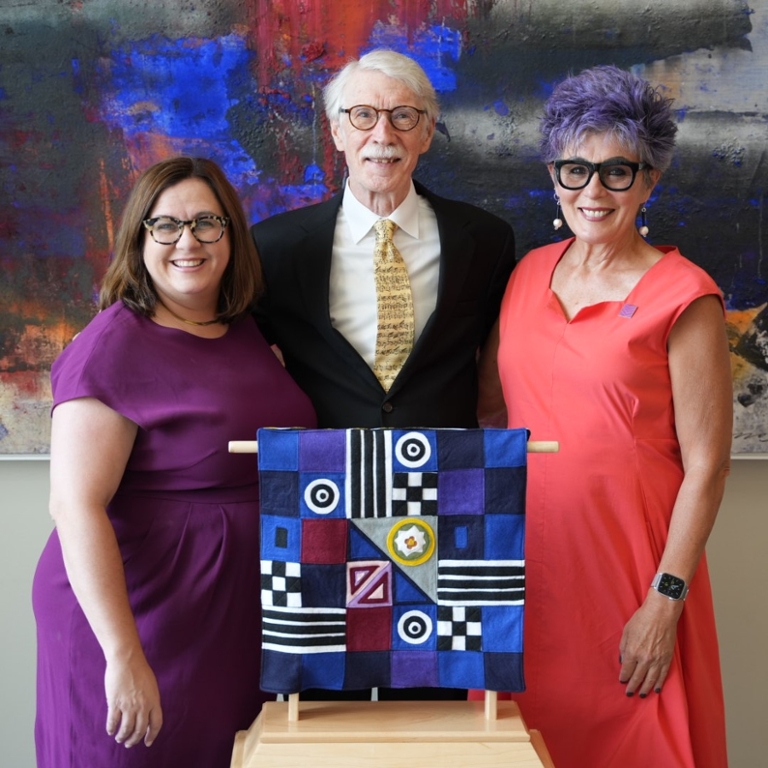 Jacobs Dean Abra Bush (left) and former faculty member Sylvia McNair (right) present George Walker (center) with the Jacobs Centennial Award.