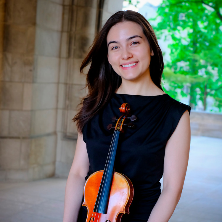 Woman smiling and holding a stringed instrument